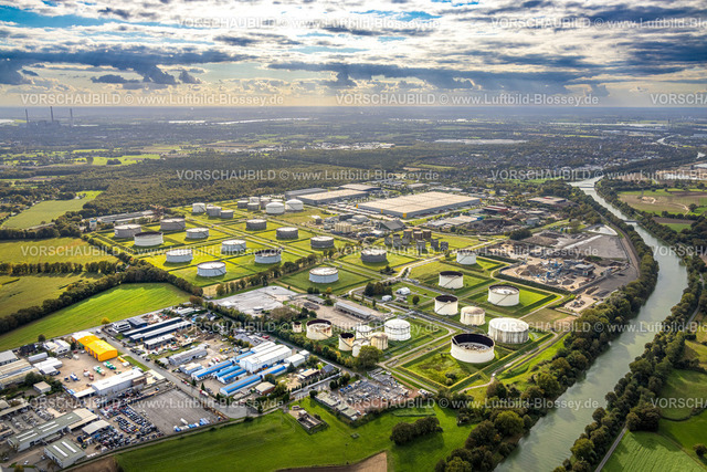 Huenxe241009799 | Luftbild, Hünxe Gewerbepark am Wesel-Datteln-Kanal mit TanQuid GmbH Tanklager Hünxe, LGI Logistics Solution GmbH Logistikdienst, Industrie- und Gewerbepark Hünxe Bucholtwelmen-West, Fernsicht und blauer Himmel mit Wolken, Bucholtwelmen, Hünxe, Niederrhein, Nordrhein-Westfalen, Deutschland