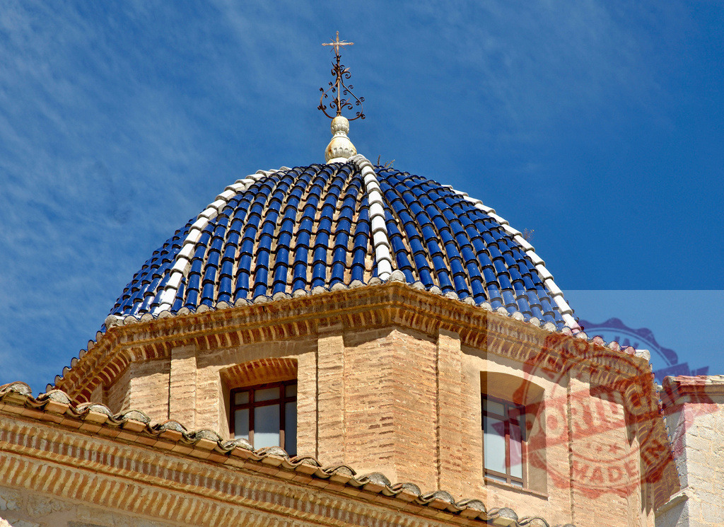 Altea church blue tiled dome top against sky. Provincia Castellon - Spain | Altea church showing iconic blue tiled dome and cross against a clear blue sky - Realized with Pictrs.com