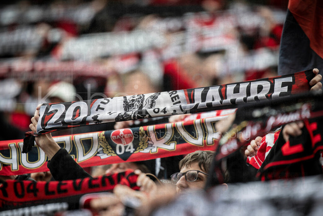 German Bundesliga, Bayer 04 Leverkusen vs. VfL Wolfsburg, 04.04.2026 | LEVERKUSEN, GERMANY - APRIL 4, 2026 :  Fans from Leverkusen hold their scarves aloft during the club anthem during the German Bundesliga match on gameday 28 between Bayer 04 Leverkusen vs. VfL Wolfsburg at BayArena on April 4, 2026 in Leverkusen, Germany. DFL REGULATIONS PROHIBIT ANY USE OF PHOTOGRAPHS AS IMAGE SEQUENCES AND/OR QUASI-VIDEO.