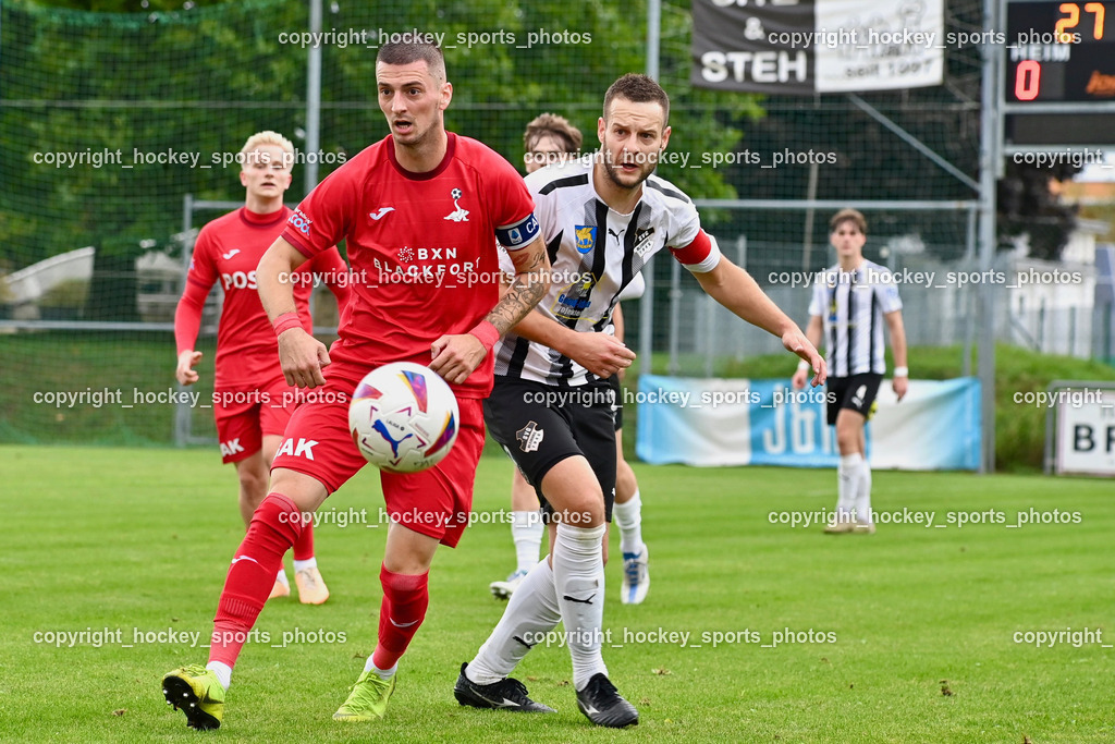 SVG Bleiburg vs. SAK 23.9.2023 | #24 Zoran Vukovic (K) SAK, #9 Adnan Besic (K) SVG Bleiburg, SVG Bleiburg vs. SAK 23.9.2023, SVG Bleiburg vs. SAK am 23.09.2023 in Bleiburg (Karl Kornberger Stadion), Austria, (Photo by Bernd Stefan)