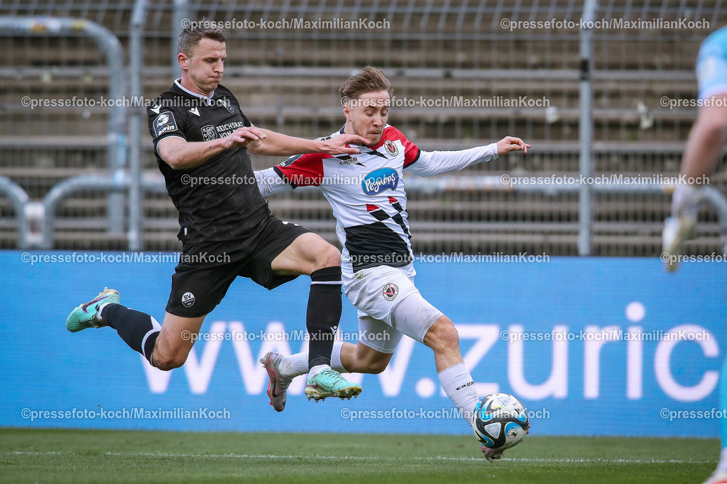 Koe3Liga24022401015 | 24.02.2024, Köln, Fußball, bwin 3. Liga Herren, Sportpark Höhenberg, 27. Spieltag, Saison 2023 2024, FC Viktoria Köln – SV Sandhausen: Edvinas Girdvainis (SV Sandhausen) gegen Luca Marseiler (Viktoria Köln). 
DFB regulations prohibit any use of photographs as image sequences and or quasi-video.