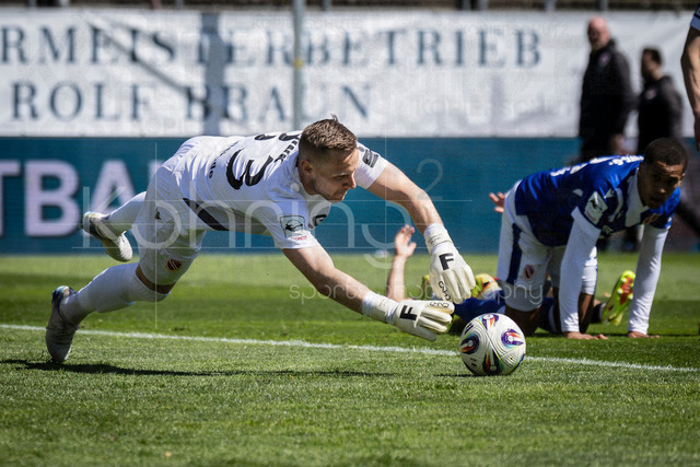 German 3rd Division, Viktoria Koeln vs. Energie Cottbus, 26.04.2026 | KOELN, GERMANY - APRIL 26, 2026:  Keeper Marius Funk (Energie Cottbus, 33) saving a ball during the 3rd division match on gameday 35 between Viktoria Koeln vs. Energie Cottbus at the Sportpark Hoehenberg on April 26, 2026 in Koeln, Germany. DFL REGULATIONS PROHIBIT ANY USE OF PHOTOGRAPHS AS IMAGE SEQUENCES AND/OR QUASI-VIDEO.