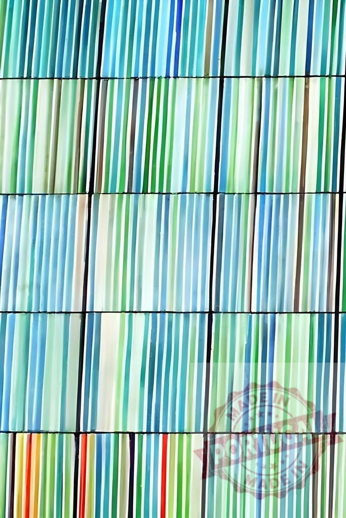 Abstract striped glass pattern creating colorful background texture | Vertical lines of blue and green glass creating a vibrant and repetitive abstract pattern - Realized with Pictrs.com