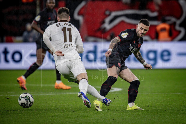 Bayer 04 Leverkusen vs. FC St. Pauli, 03.02.2026 | LEVERKUSEN, GERMANY - FEBRUARY 3:  Aleix Garcia (Bayer 04 Leverkusen, 24) fouls Arkadiusz Pyrka (FC St. Pauli, 11) during the DFB Cup quarter-final match Bayer 04 Leverkusen vs. FC St. Pauli at BayArena on February 3, 2026 in Leverkusen, Germany. (Photo by Axel Kohring/Beautiful Sports Int.)DFL REGULATIONS PROHIBIT ANY USE OF PHOTOGRAPHS AS IMAGE SEQUENCES AND/OR QUASI-VIDEO.