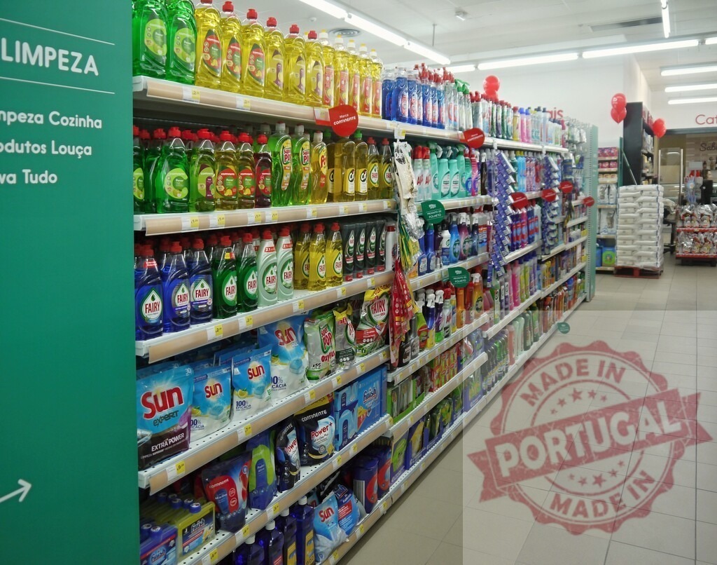 Supermarket aisle featuring varied household cleaning products | Supermarket aisle displaying shelves stocked with various cleaning agents and detergents - Realized with Pictrs.com