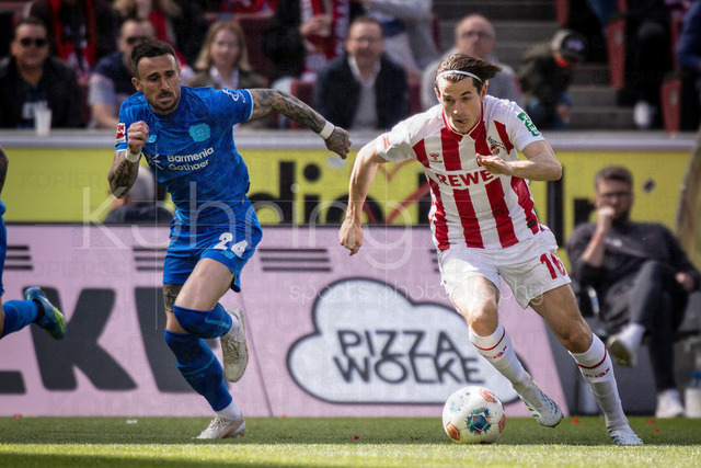German Bundesliga,  1. FC Koeln - Bayer 04 Leverkusen, 25.04.2026 | KOELN, GERMANY - APRIL 25, 2026 :  Aleix Garcia (Bayer 04 Leverkusen, 24), Jakub Kaminski (1. FC Koeln, 16) during the German Bundesliga match on gameday 31 between 1. FC Koeln - Bayer 04 Leverkusen at RheinEnergieSTADION on April 25, 2026 in Koeln, Germany. DFL REGULATIONS PROHIBIT ANY USE OF PHOTOGRAPHS AS IMAGE SEQUENCES AND/OR QUASI-VIDEO.
