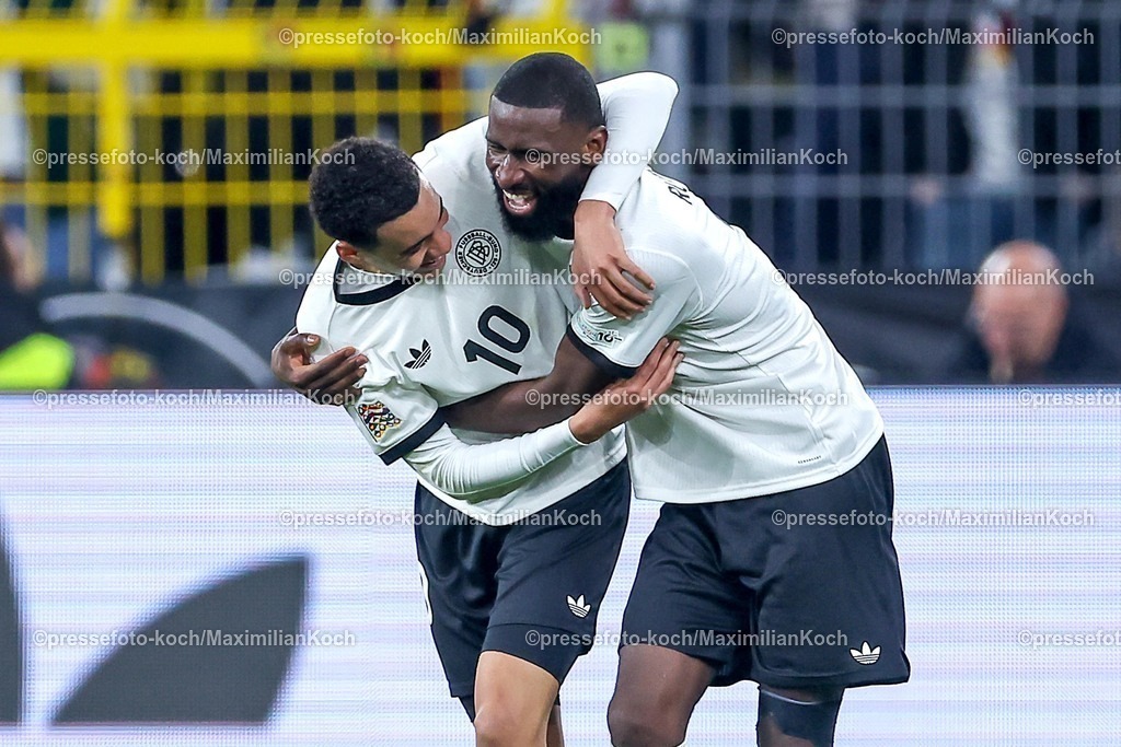 DFB23032501034 | 23.03.2025, Fußball, Viertelfinale UEFA Nations League, Deutschland - Italien, Signal Iduna Park, Saison 2024 2025: Torjubel nach dem Tor zum 2:0 durch Torschütze Jamal Musiala (GER #10) zusammen mit Antonio Rüdiger (GER #02) DFB regulations prohibit any use of photographs as image sequences and or quasi-video.
