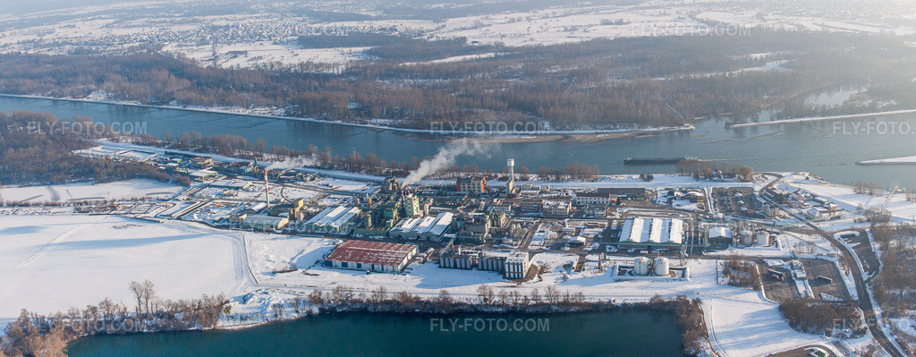 Aerial view: Wintery, snow-covered factory premises of the chemical producer DOW SAS on the banks of the Rhine in Lauterbourg in the state Bas-Rhin, France.Photo: IMG_36584-Bearbeitet.jpg taken on 01/05/2011 by Werner Riehm/FLY-FOTO.comResolution of the original: 7247 x 2823 px