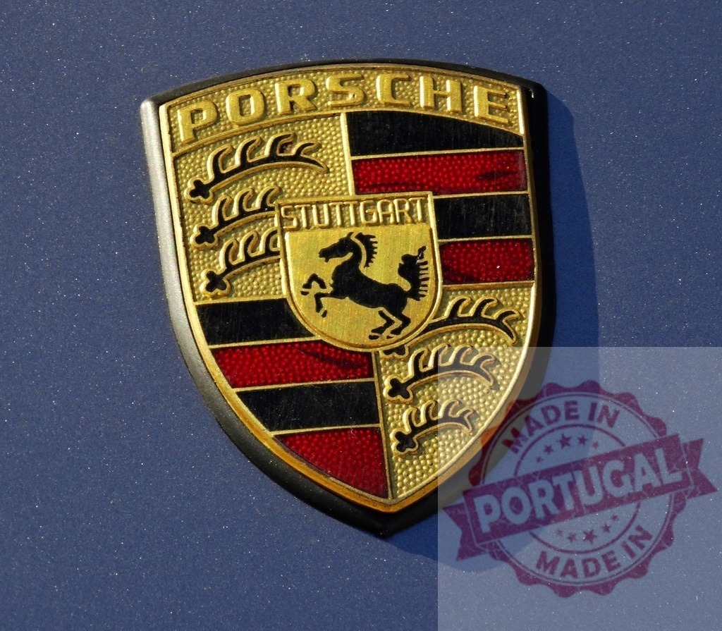 Porsche logo emblem showing Stuttgart coat of arms | Porsche luxury car brand emblem on a blue vehicle surface - Realized with Pictrs.com