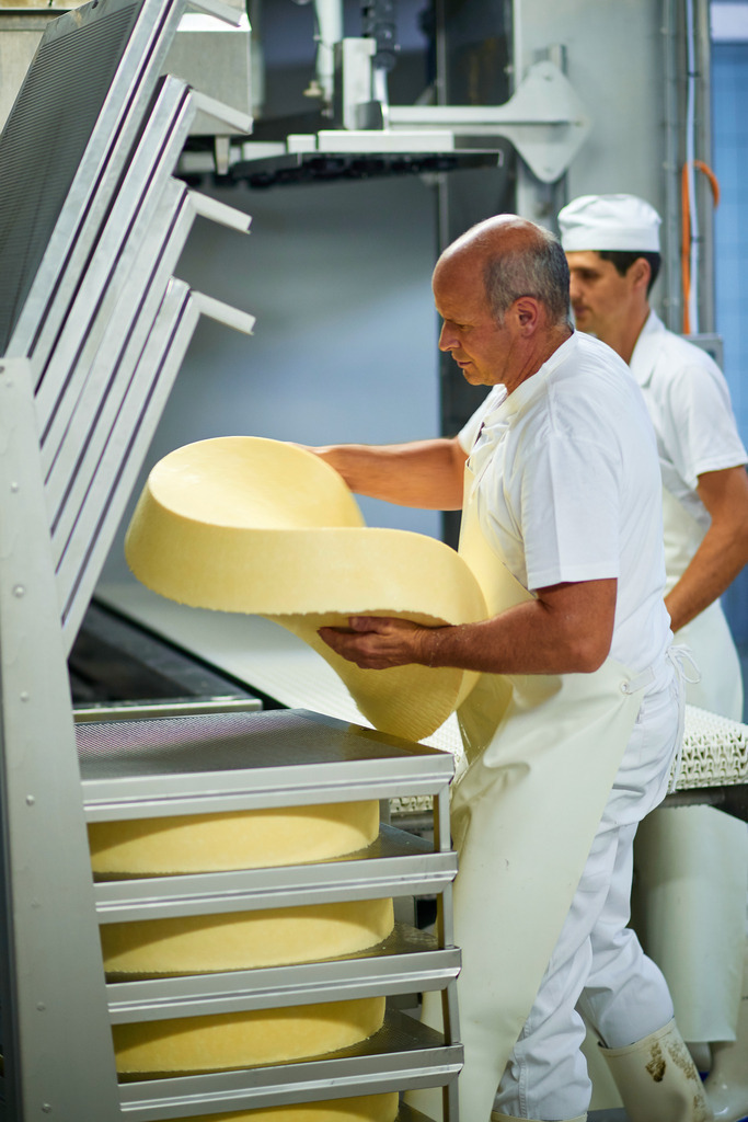 Sennerei Hittisau | Hittisau, Austria - July 29, 2019: Sennerei Hittisau; die weichen Käselaibe  werden aus der Presse entnommen. - Realisiert mit Pictrs.com