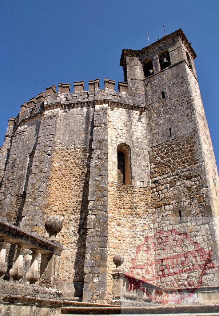 Convent of Christ medieval castle architecture in Tomar Portugal | Tomar's Convent of Christ displaying ancient stone architecture and a tall bell tower - Realized with Pictrs.com