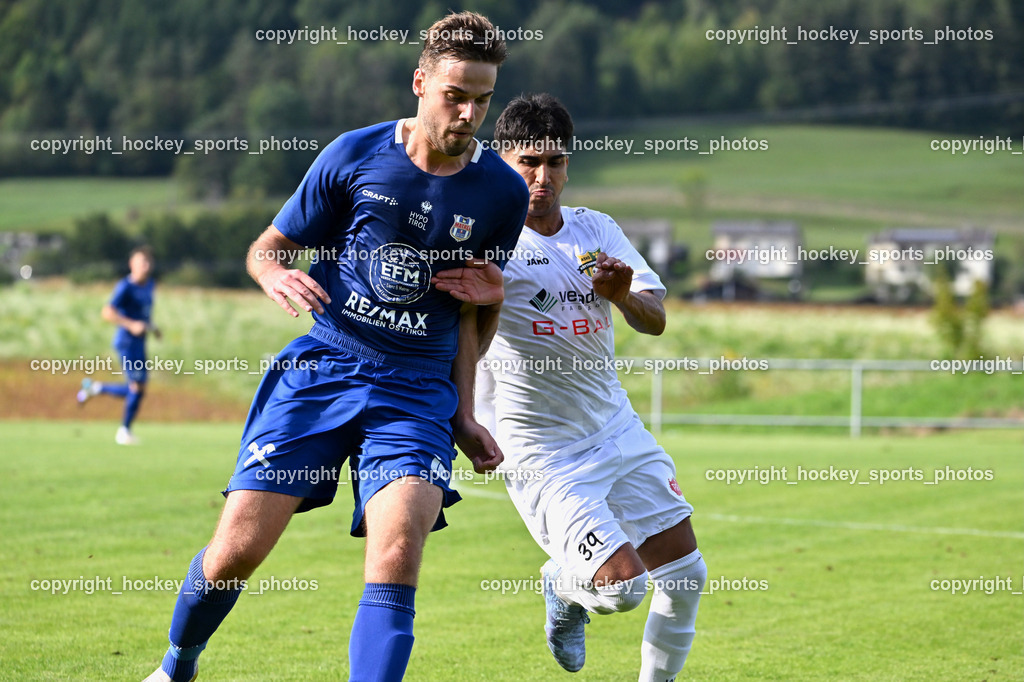 ASKÖ Köttmannsdorf vs. Union Matrei | #8 Benjamin Cosic UNION Matrei, #39 Amir Mohammadi ASKÖ Köttmannsdorf, ASKÖ Köttmannsdorf vs. Union Matrei, ASKÖ Köttmannsdorf vs. Union Matrei am 13.09.2025 in Köttmannsdorf (Sportplatz Köttmannsdorf), Austria, (Photo by Bernd Stefan)