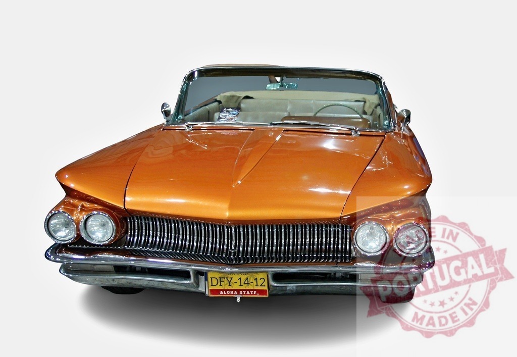 Shiny orange Buick Electra 225 convertible posing in a studio | Classic Buick Electra 225 convertible with orange paint job posing in a studio with white background - Realized with Pictrs.com