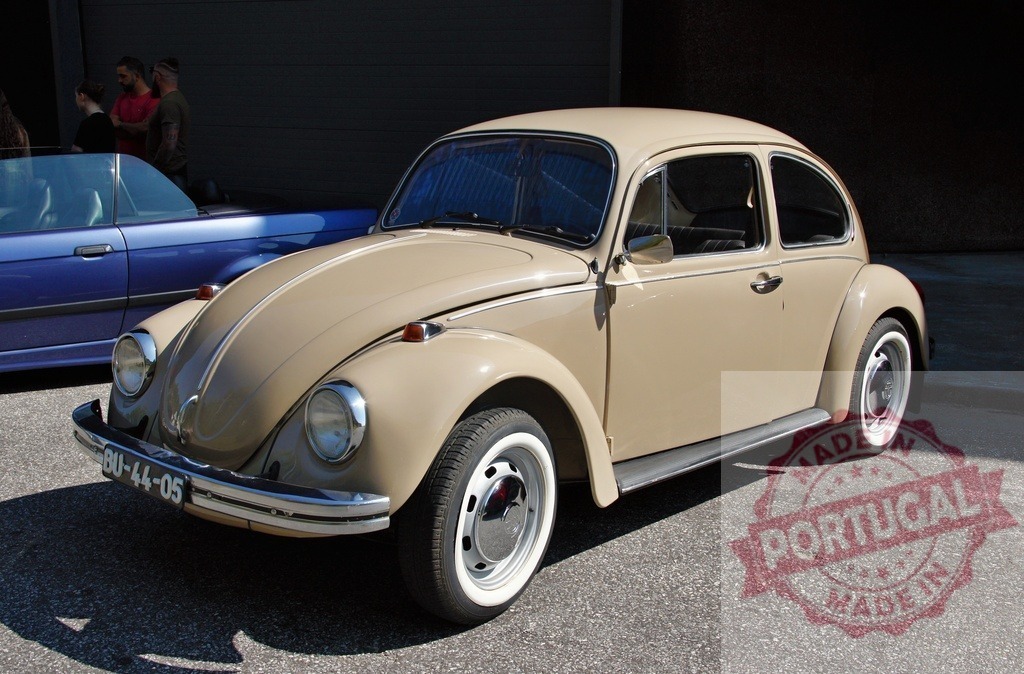 Beige Volkswagen Beetle parked near a garage | Classic beige Volkswagen Beetle parked near a garage in a sunny day - Realized with Pictrs.com