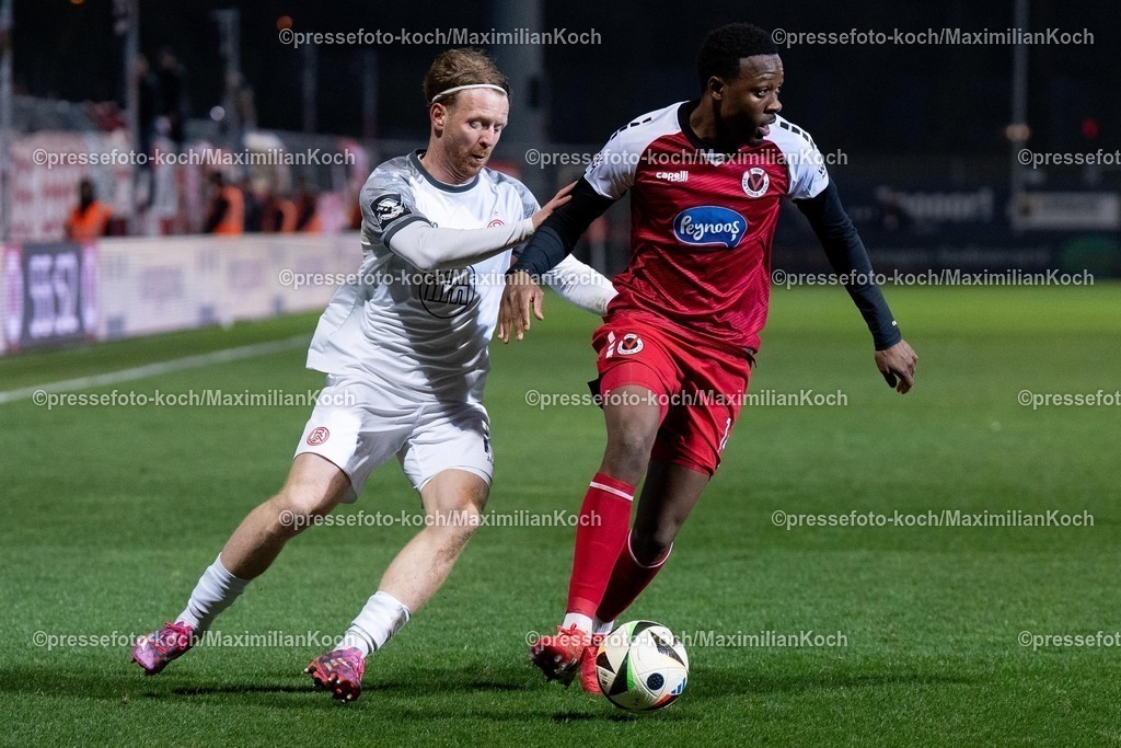 xYDR12032501167 | 12.03.2025, xydrx, Fußball, Viktoria Köln - Rot-Weiss Essen, 3.Liga, Sportpark Höhenberg, Saison 2024 2025:  Enrique Lofolomo (Viktoria Köln #14) im Zweikampf gegen Dominik Martinovic (Rot-Weiss Essen #27). DFB regulations prohibit any use of photographs as image sequences and or quasi-video.