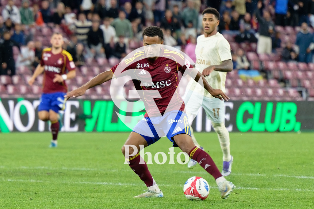 UEFA Conference League Play-offs 2nd leg - Servette FC v FC Shakhtar Donetsk | Lilian Njoh (14 Servette FC) shoots the ball (action)  during the UEFA Conference League Play-offs 2nd leg match between Servette FC and FC Shakhtar Donetsk at Stade de Geneve in Geneva, Switzerland