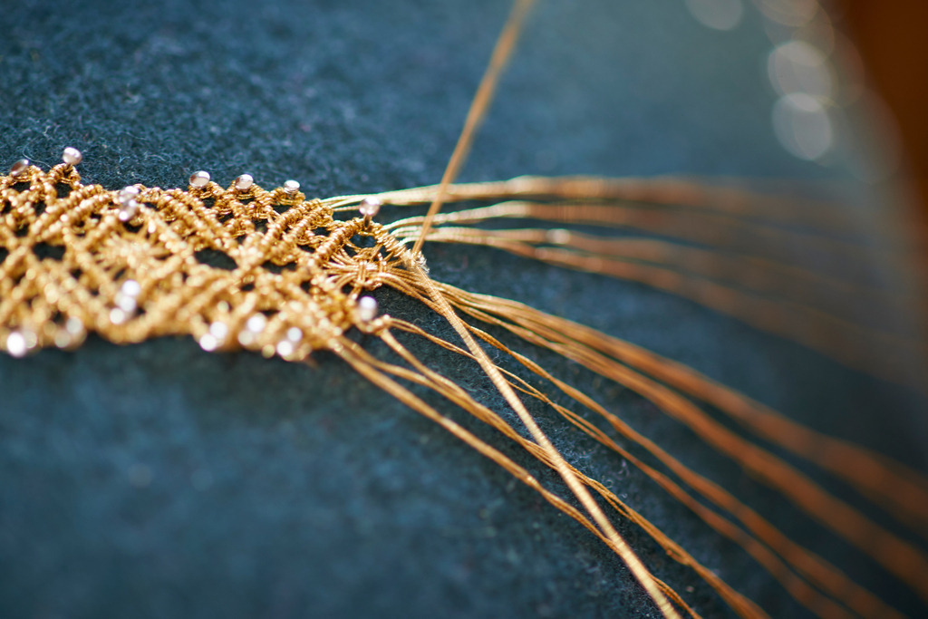 Erzeugung von Schmuckbaender aus Goldfaeden | Andelsbuch, Austria - May 27, 2016: Steurer Katharina; Erzeugung von Schmuckbaender aus Goldfaeden-Keadara. - Realisiert mit Pictrs.com