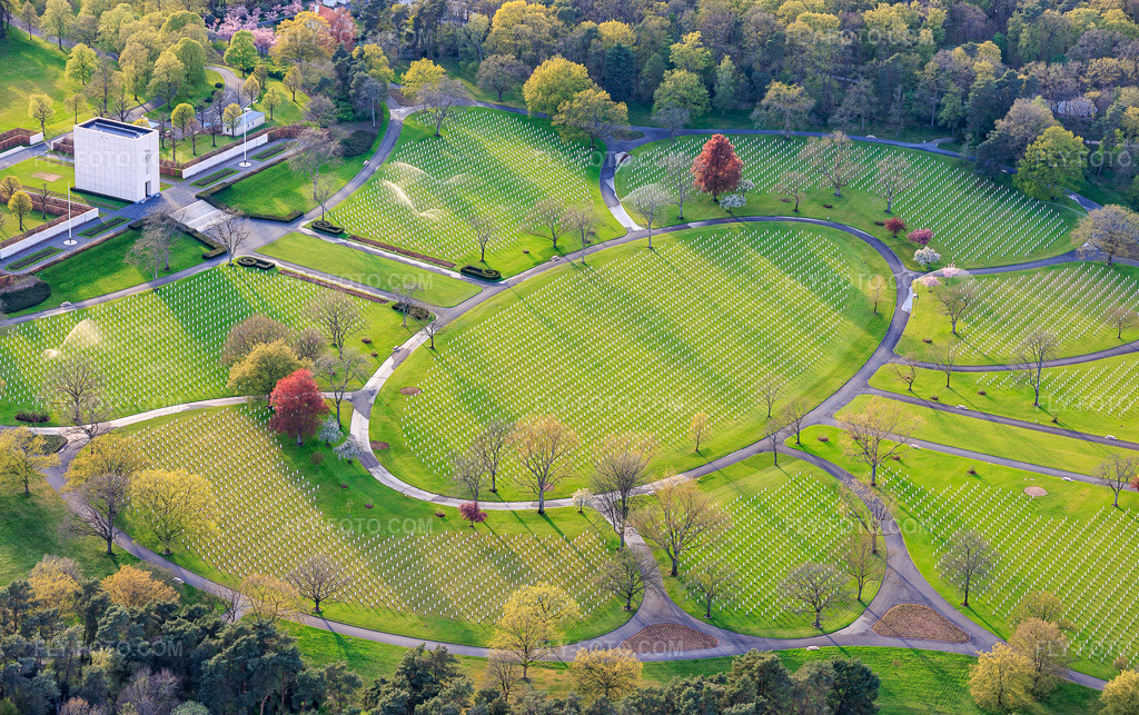 Aerial view: Gravestone rows and parkland at the American Military Cemetery and Memorial Site of Saint-Avold in the district Forêts de Zang et du Steinberg in Saint-Avold in the state Moselle, France. – Photo: IMG_154301.jpg taken on 04/17/2026 by Werner Riehm/FLY-FOTO.com – Resolution of the original: 5791 x 3637 px – About Lorraine American Cemetery - American Battle Monuments Commission (ABMC)