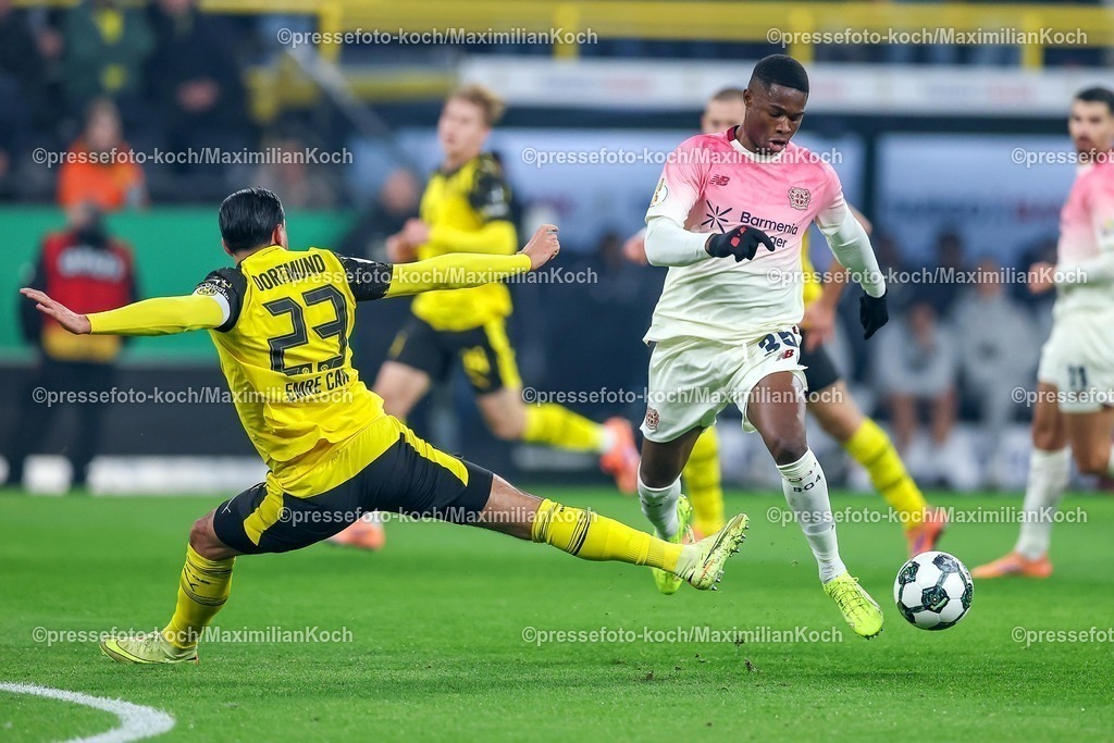 BVB02122501035 | 02.12.2025, Fußball, DFB-Pokal, Borussia Dortmund - Bayer 04 Leverkusen, Achtelfinale, Signal Iduna Park, Saison 2025 2026: Emre Can  (BVB #23) im Zweikampf gegen  Christian Kofane (Bayer04 #35) DFB regulations prohibit any use of photographs as image sequences and or quasi-video.