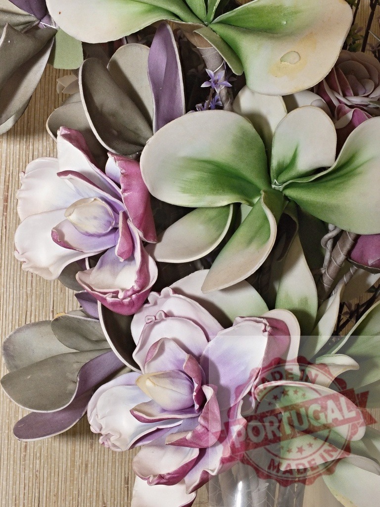 Artificial floral arrangement displaying fake purple and green flowers | Artificial flowers crafted from paper providing a decorative background - Realized with Pictrs.com