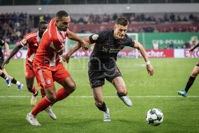 DFB Cup semifinal match Bayer 04 Leverkusen vs. FC Bayern Munich, 22.04.2026 | LEVERKUSEN, GERMANY - APRIL 22, 2026: Jonathan Tah (FC Bayern Muenchen, 4) and Patrik Schick (Bayer 04 Leverkusen, 14) during the German DFB Cup semifinal match between Bayer 04 Leverkusen vs. FC Bayern Munich at BayArena on April 22, 2026 in Leverkusen, Germany. DFL REGULATIONS PROHIBIT ANY USE OF PHOTOGRAPHS AS IMAGE SEQUENCES AND/OR QUASI-VIDEO.
