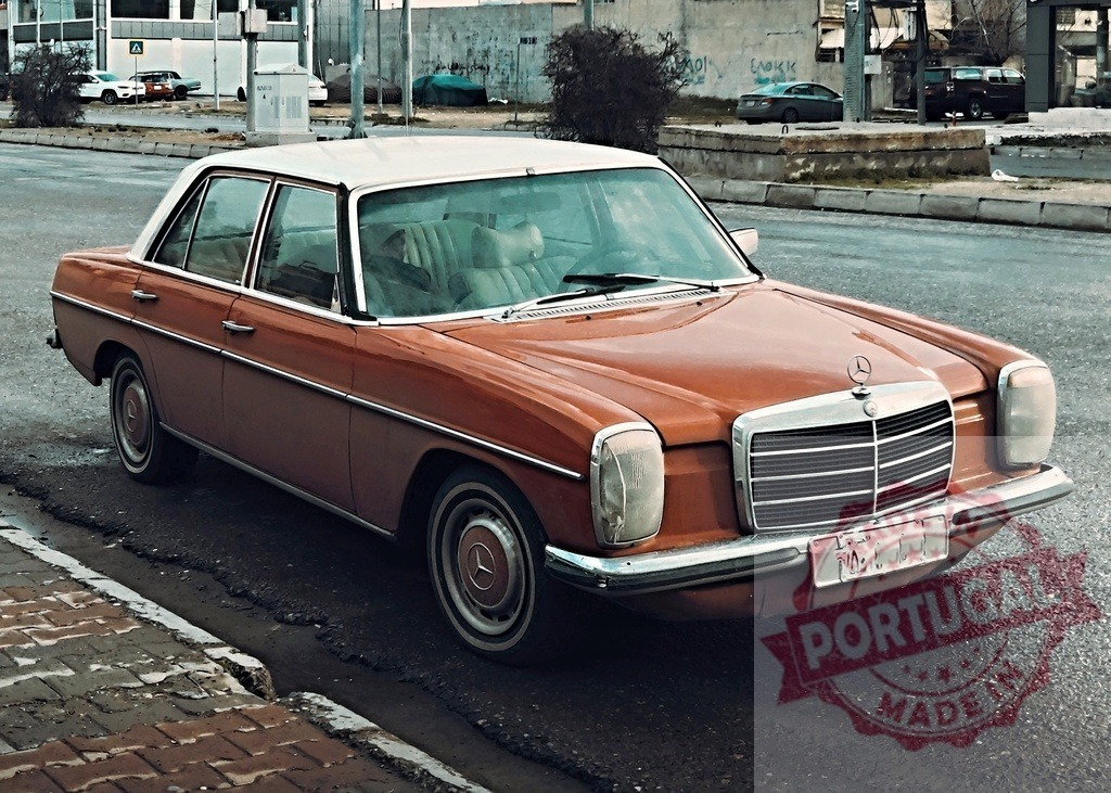 Mercedes-Benz vintage sedan parked on urban street | Brown and white classic Mercedes-Benz W114 or W115 sedan standing on a city street - Realized with Pictrs.com