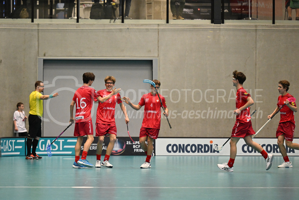 Switzerland B U19 vs Switzerland U19 - 4. February 2024 | Switzerland B U19 vs Switzerland U19
U19 Men International Matches in Switzerland
GoEasy Arena, Siggenthal Station
Switzerland forward #16 Dario Bürgler scores and celebrates with forward #5 Severin Schmid and forward #4 Sebastian Mathis.
Credit: Markus Aeschimann | <a href="https://www.markus-aeschimann.ch">Sportfotografie Markus Aeschimann</a> | <a href="https://www.instagram.com/sportfotografie.aeschimann">@sportfotografie.aeschimann</a> - Realisiert mit Pictrs.com