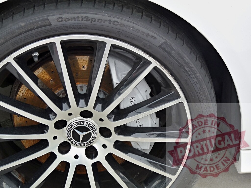 Mercedes-Benz car wheel with rusty brake disc | Mercedes-Benz car wheel showing alloy rim, tire, brake caliper, and rusty brake disc - Realized with Pictrs.com