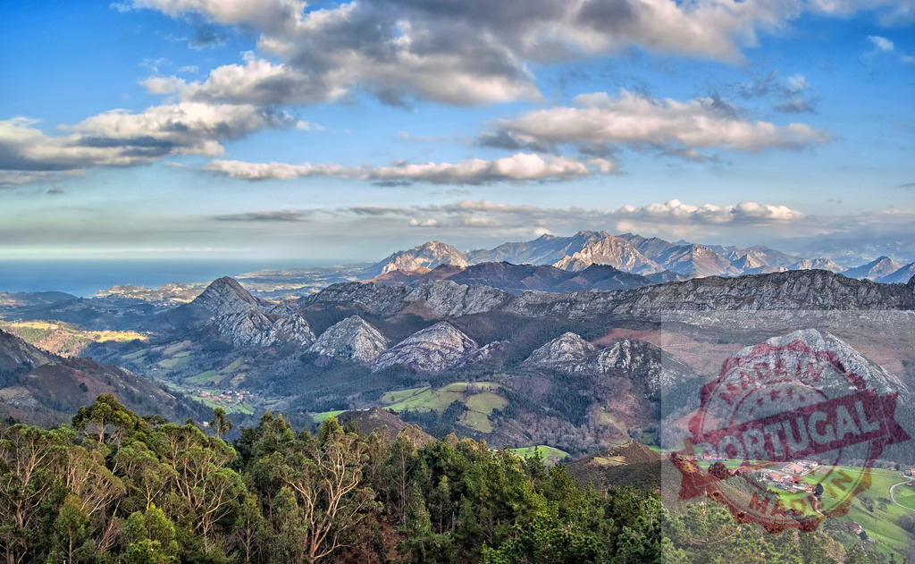 Breathtaking panorama unfolding over the Picos de Europa mountain range in Spain | Stunning vista encompassing the Picos de Europa mountains, showcasing the rugged peaks, lush valleys, and distant Cantabrian Sea under a cloudy sky - Realized with Pictrs.com