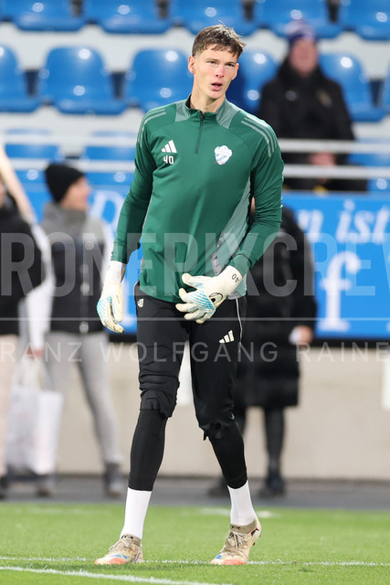TSV Egger Glas Hartberg vs SV Oberbank Ried – Austrian Bundesliga Match | TSV Egger Glas Hartberg and SV Oberbank Ried. High-intensity match action, tackles, shots on goal, celebrations, fan atmosphere and stadium scenes captured in professional quality. The image shows Tom Ritzy Huelsmann (Hartberg).
