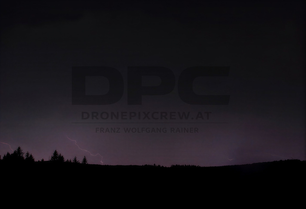 Lightning Storm over the Almenland | Multiple lightning strikes illuminate the night sky over the Almenland region in Austria during a powerful summer thunderstorm. - Realisiert mit Pictrs.com