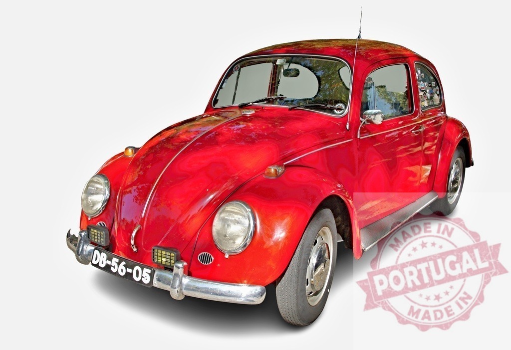 Classic red Volkswagen Beetle car parked on white background | Shiny red Volkswagen Beetle parked, showing its vintage design and timeless appeal - Realized with Pictrs.com