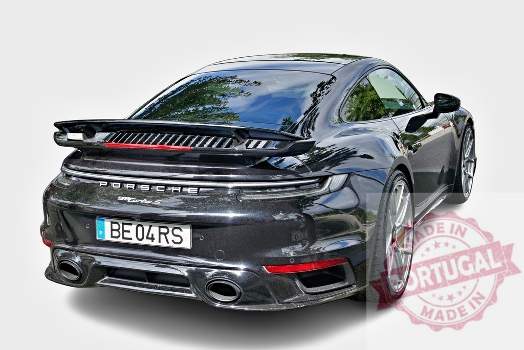 Porsche 911 Turbo S black sports car parked | Black Porsche 911 Turbo S performance sports car showing rear view - Realized with Pictrs.com