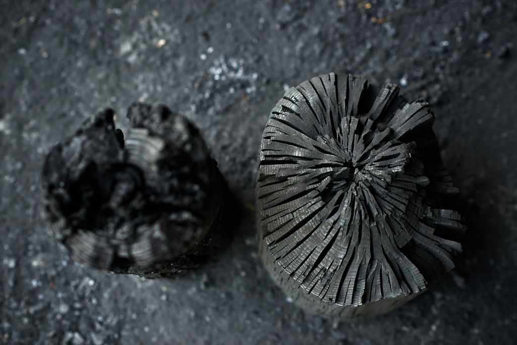 Waldköhlerei Hochecker | Michelbach, Austria - May 08, 2019: Waldköhlerei Hochecker, die 2011 in das Nationale Verzeichnis des immateriellen Kulturerbes der UNESCO aufgenommen wurde, produziert noch echte Holzkohle, verkohltes Weichholz und Hartholz. - Realisiert mit Pictrs.com