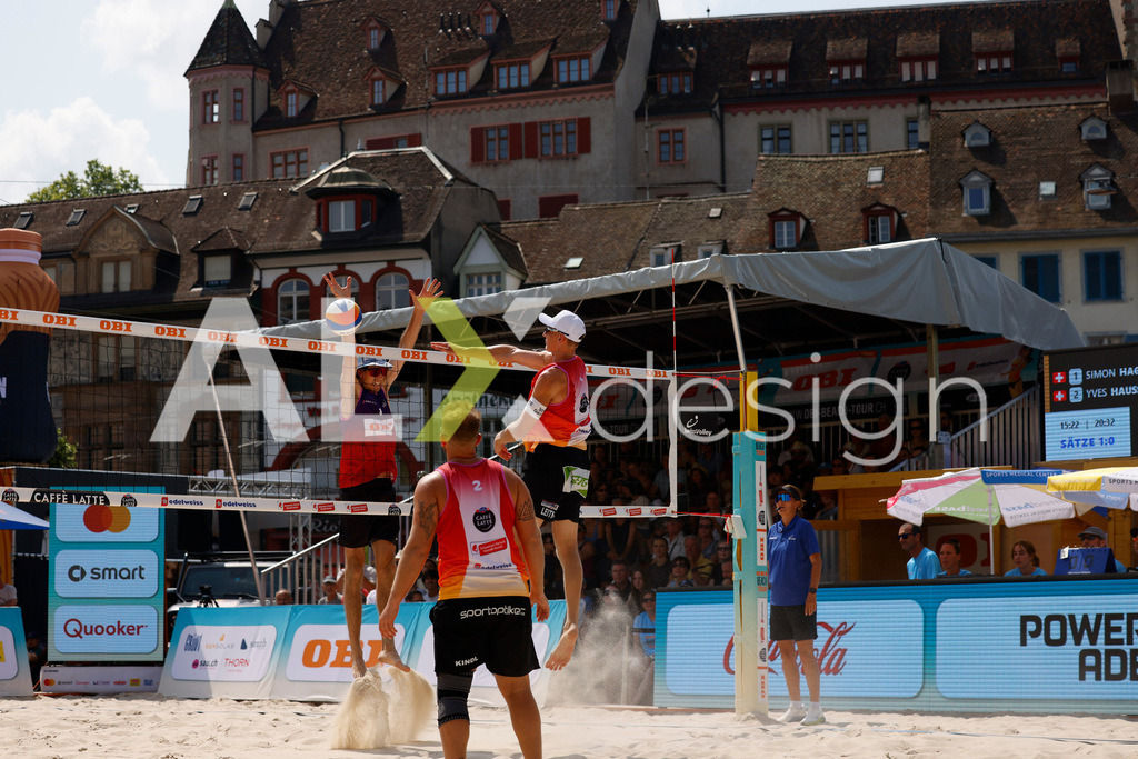Obi BeachTour 2026 - Basel | BASEL, SWITZERLAND - JULY 19: LAURENZ LEITNER (AUT) attack / spike against SIMON HAGENBUCH (SUI) block during the Obi BeachTour 2026 match between HAGENBUCH / HAUSSENER (SUI) and LEITNER / KINDL (AUT) at Barfüsserplatz on July 19, 2026 in Basel, Switzerland. - Realisiert mit Pictrs.com