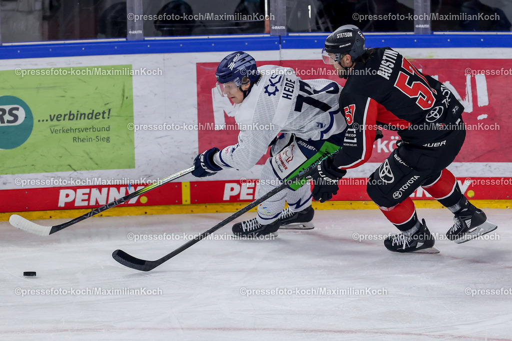 KEC22122401035 | 22.12.2024, Eishockey, DEL, Kölner Haie - Straubing Tigers, Spieltag 29, Lanxess-Arena Köln: Elis Hede (Straubing Tigers #75) gegen Brady Austin (Kölner Haie #57)