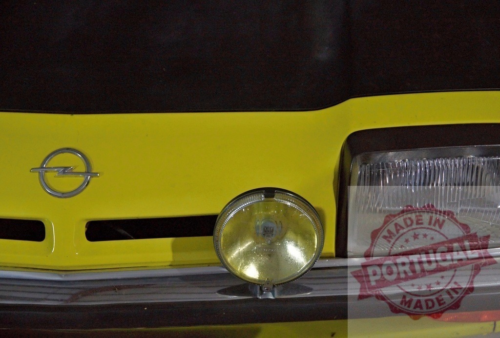 Opel vintage car showing headlight and logo | Opel classic car detail featuring yellow body, headlight, and brand logo - Realized with Pictrs.com