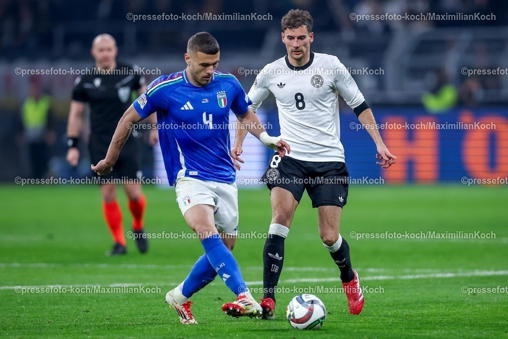 DFB23032502202 | 23.03.2025, Fußball, Viertelfinale UEFA Nations League, Deutschland - Italien, Signal Iduna Park, Saison 2024 2025: Alessandro Buongiorno (ITA #04) im Zweikampf gegen Leon Goretzka (GER #08) DFB regulations prohibit any use of photographs as image sequences and or quasi-video.