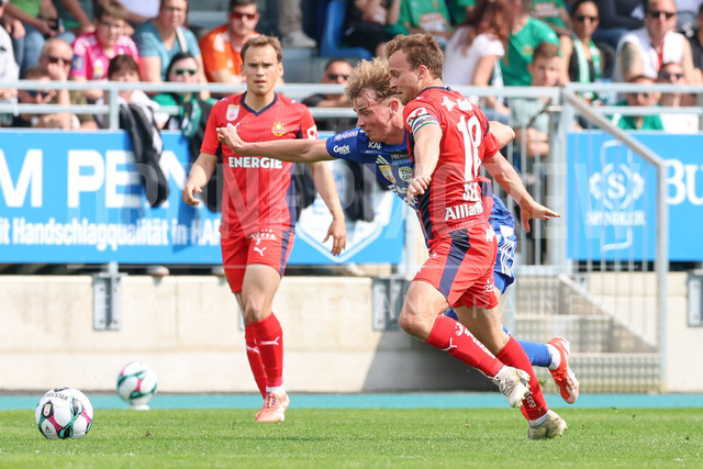 TSV Egger Glas Hartberg vs SK Rapid Wien – Championship Group    | Hartberg, Austria, 19.Apr.26 - SOCCER - ADMIRAL Bundesliga, TSV Egger Glas Hartberg vs SK Rapid Wien. The image shows Fabian Wilfinger (Hartberg) and Matthias Seidl (SK Rapid Wien). 