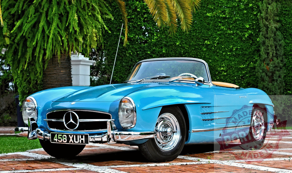Mercedes-Benz 300 SL Roadster parked in front of a beautiful garden | Classic Mercedes-Benz 300 SL Roadster parked in a driveway in front of a beautiful hedge and palm trees - Realized with Pictrs.com