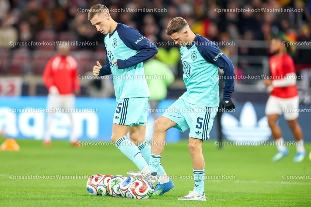 DFB30032600019 | 30.03.2026, Fußball, Länderspiel, Deutschland - Ghana, MHP-Arena (Stuttgart), Saison 2025 2026: Nico Schlotterbeck (GER #15) Pascal Groß (GER #05)  DFB regulations prohibit any use of photographs as image sequences and or quasi-video.