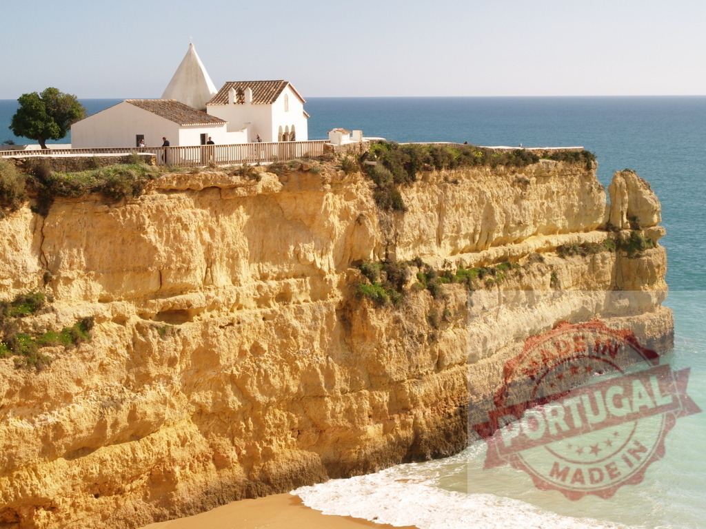Chapel of Nossa Senhora da Rocha on Algarve cliff | White chapel standing on a dramatic limestone cliff overlooking the turquoise Atlantic Ocean - Realized with Pictrs.com