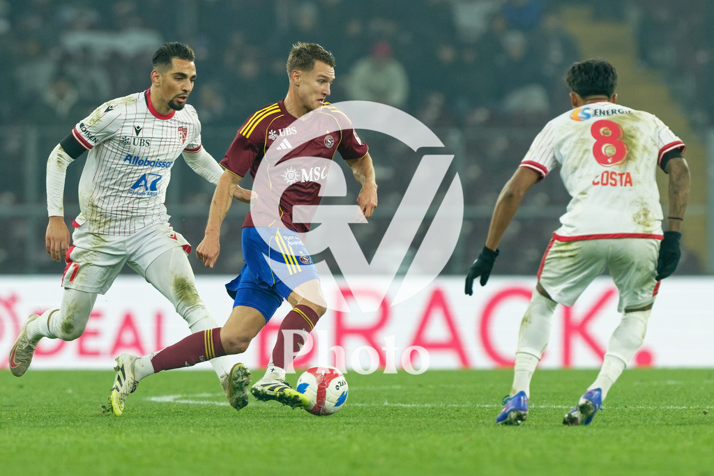 Brack Super League - Servette FC v FC Sion | Marco Burch (15 Servette FC) in action (close up) under pressure of Baltazar Costa (8 FC Sion) during the Brack Super League match between Servette FC and FC Sion at Stade de Geneve in Geneva, Switzerland