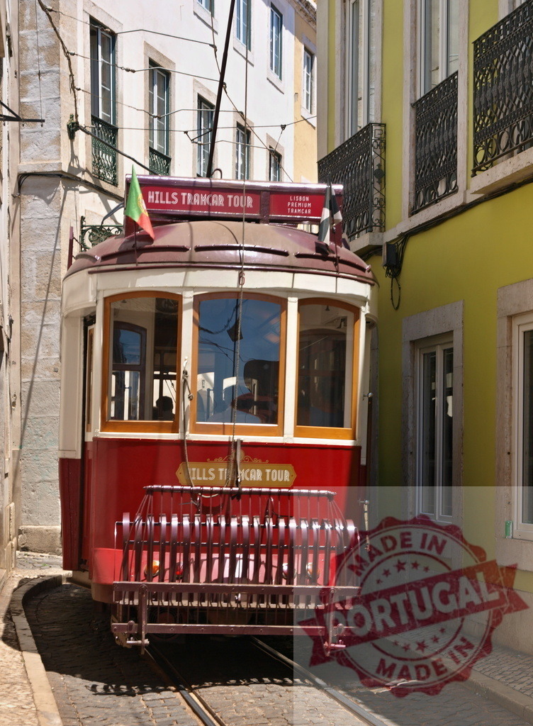 Red and white Lisbon Hills Tramcar Tour navigating narrow streets in Lisbon, Portugal | Vintage Lisbon Hills Tramcar Tour navigating narrow streets in Lisbon, Portugal, during a sunny summer day - Realized with Pictrs.com