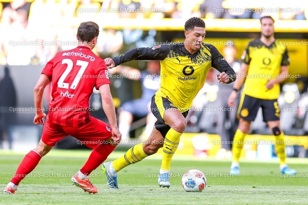 BVB26042601027 | 26.04.2026, Fußball, Borussia Dortmund - SC Freiburg, 1. Fußball Bundesliga, 31. Spieltag, Signal Iduna Park, Saison 2025 2026: Nicolas Höfler&nbsp;(SC Freiburg #27) im Zweikampf gegen  Jobe Bellingham&nbsp;(BVB #07)  DFB regulations prohibit any use of photographs as image sequences and or quasi-video.