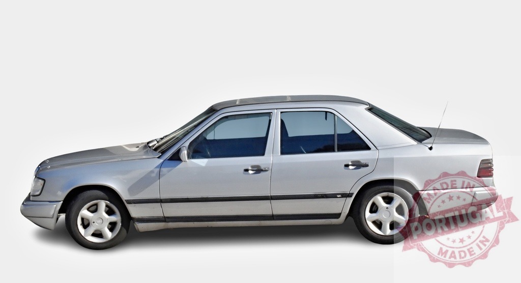 Silver Mercedes-Benz W124 parked showing driver side on white background | Classic Mercedes-Benz W124 sedan parked, showcasing its elegant design and timeless appeal - Realisiert mit Pictrs.com