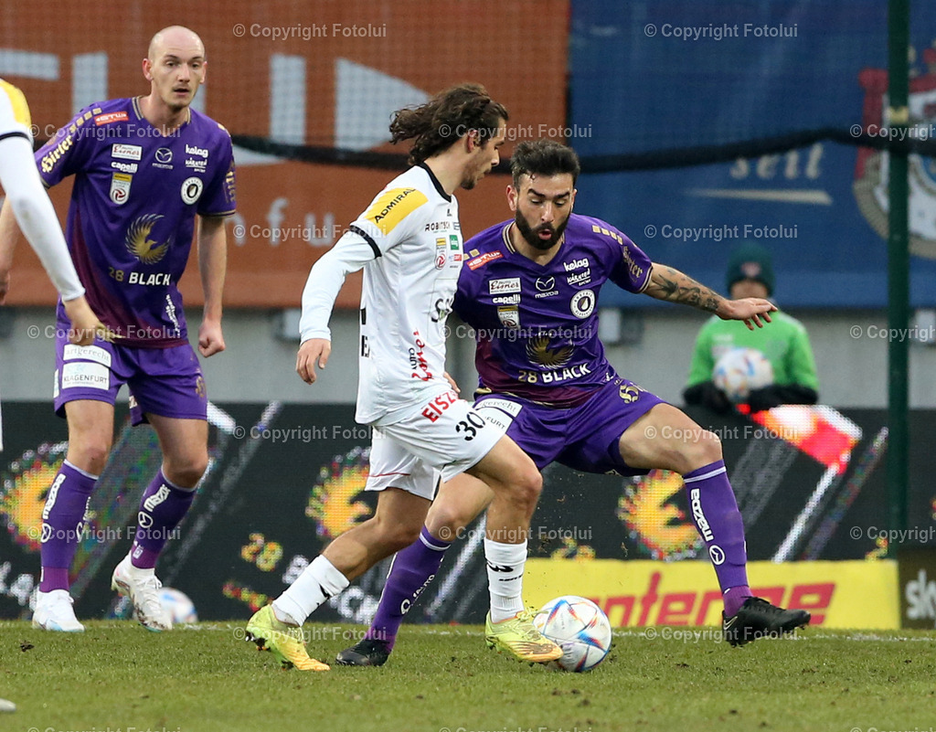 A_LUI_18022023_12 | SPORT,FUSSBALL,ADMIRAL BUNDESLIGA AUSTRIA KLAGENFURT-WOLFSBERGER AC 18.02.2023IM BILD. KOSMAS GKEZOS (KLAGENFURT) UND MATTHAEUS TAFERNER (WOLFSBERG) FOTO.FOTOLUI/MARIO WIMMER