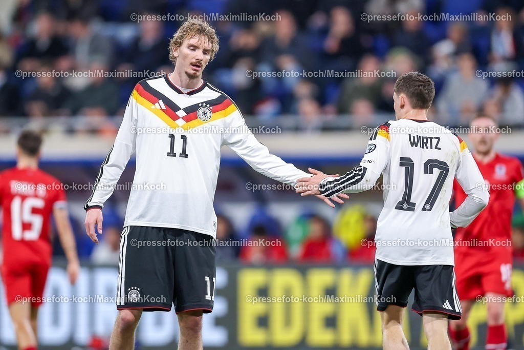 DFB14112501084 | 14.11.2025, Fußball, Länderspiel, WM-Qualifikation Europa, Deutschland - Luxemburg, Stade de Luxembourg (Croix de Gasperich, Luxemburg), 9. Spieltag, Saison 2025 2026: Nick Woltemade (GER #11) klatscht sich mit Florian Wirtz (GER #17) ab Regulations prohibit any use of photographs as image sequences and or quasi-video.