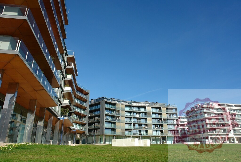 Modern residential urban buildings with green lawn | Modern architecture apartment buildings creating a contemporary living space under a clear blue sky - Realisiert mit Pictrs.com