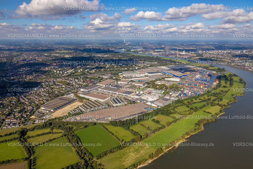 Duisburg241003575 | Luftbild, logport I (Eins) Rheinhausen, duisport mit D3T Duisburg Trimodal Terminal, DIT Duisburg Intermodal Terminal und Automobil-Logistik am Fluss Rhein, Fernsicht und blauer Himmel mit Wolken, Friemersheim, Duisburg, Ruhrgebiet, Nordrhein-Westfalen, Deutschland